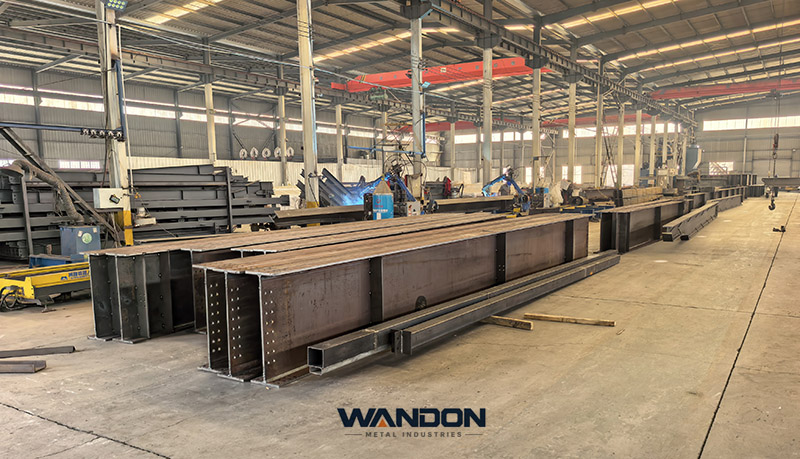 Large steel girders being fabricated inside the WANDON steel structure workshop